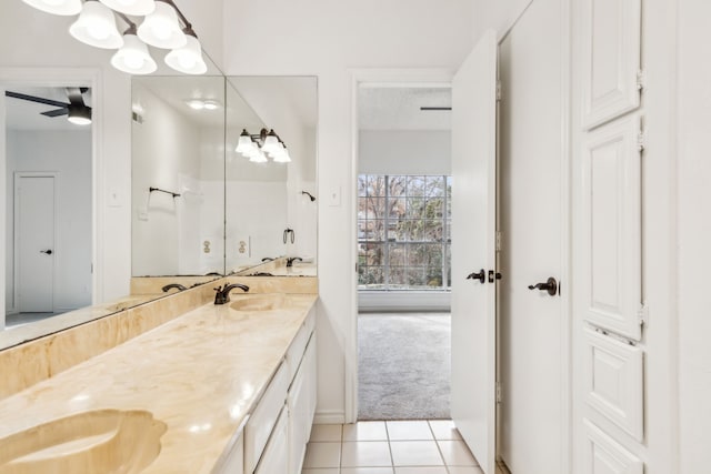 bathroom featuring tile patterned flooring, vanity, and ceiling fan