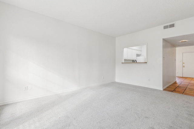 unfurnished room with carpet