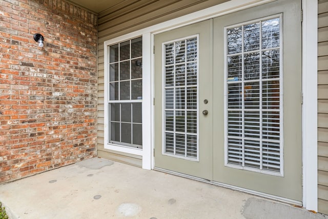 property entrance with french doors and a patio