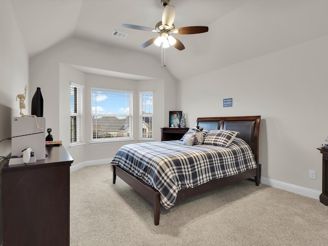 carpeted bedroom with visible vents, baseboards, a ceiling fan, and vaulted ceiling