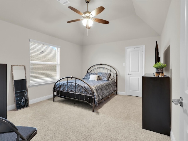 bedroom featuring baseboards, lofted ceiling, carpet, and a ceiling fan