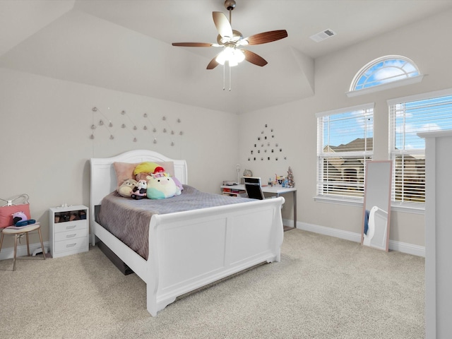 bedroom featuring visible vents, baseboards, light colored carpet, and a ceiling fan