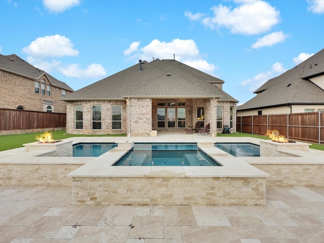 view of pool with a fenced in pool, a fire pit, a fenced backyard, and a patio area