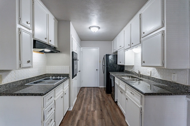 kitchen featuring dark wood-type flooring, sink, white cabinetry, decorative backsplash, and black appliances