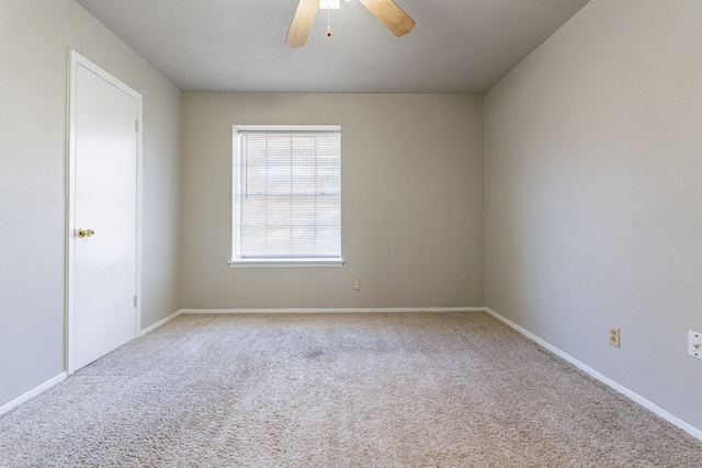 unfurnished room with ceiling fan and carpet floors