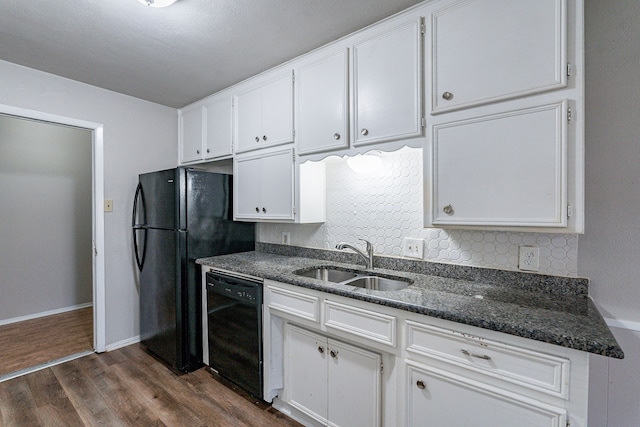 kitchen with white cabinets, dark hardwood / wood-style flooring, black appliances, and sink