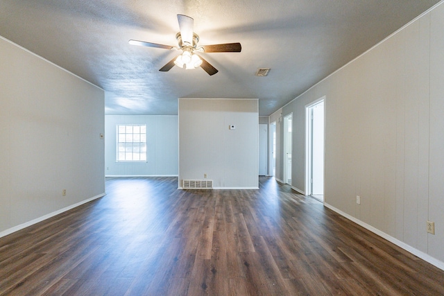 unfurnished room with ceiling fan and dark wood-type flooring