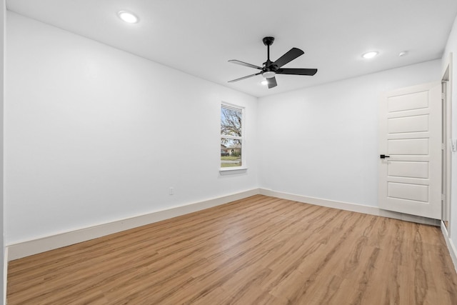 unfurnished room featuring ceiling fan and light hardwood / wood-style flooring