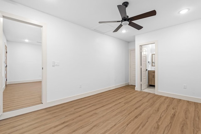 unfurnished bedroom with ensuite bathroom, ceiling fan, and light hardwood / wood-style floors