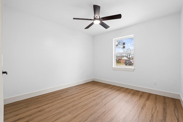 empty room featuring ceiling fan and wood-type flooring