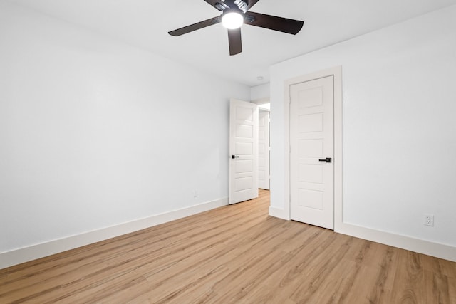 unfurnished room with ceiling fan and light wood-type flooring