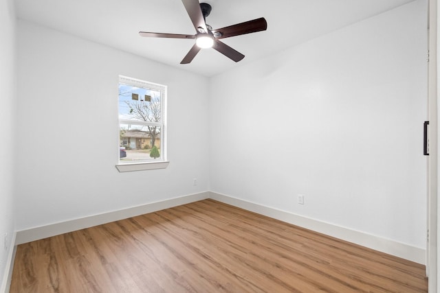 empty room featuring ceiling fan and light hardwood / wood-style floors