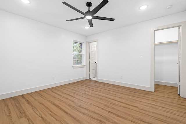 unfurnished room with ceiling fan and light hardwood / wood-style floors