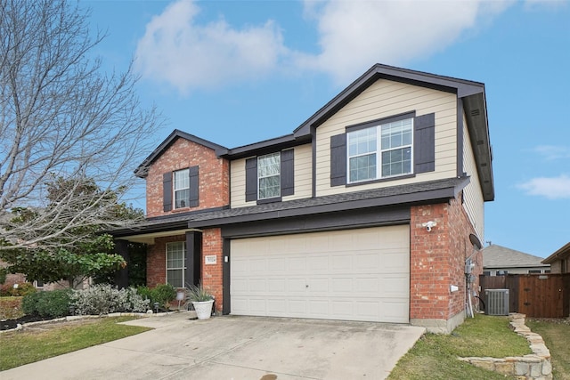 view of front of home featuring a garage and central AC unit