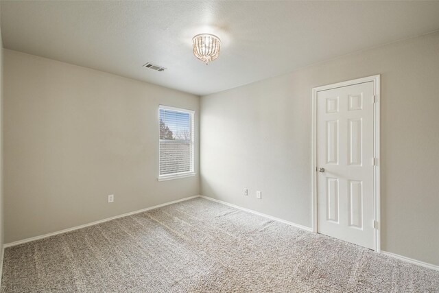 unfurnished bedroom featuring ceiling fan and light carpet