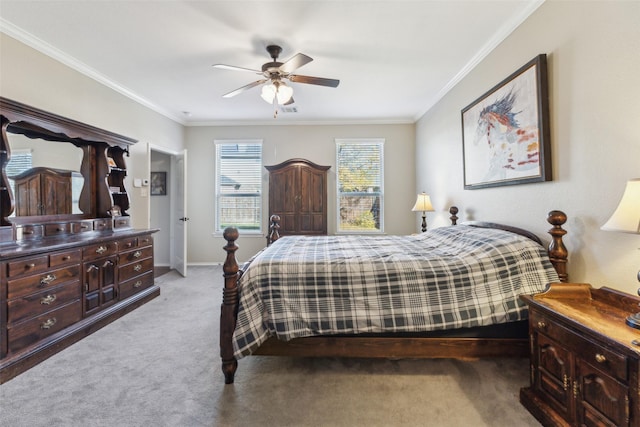 bedroom featuring ornamental molding, light colored carpet, and ceiling fan