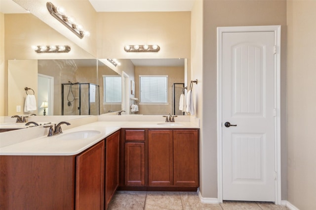 bathroom featuring vanity, tile patterned floors, and walk in shower