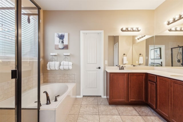 bathroom with vanity, tile patterned floors, and separate shower and tub