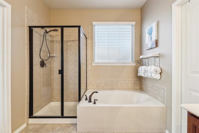 bathroom featuring plus walk in shower and vanity