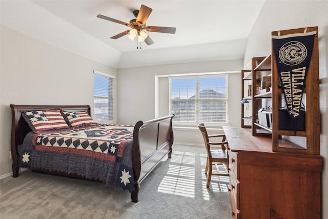 carpeted bedroom with lofted ceiling and ceiling fan