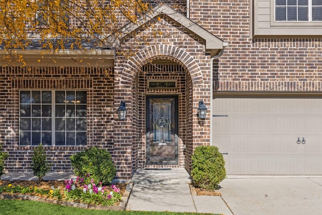 view of exterior entry featuring a garage