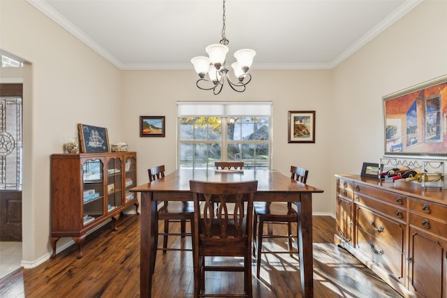 dining room featuring ornamental molding, dark hardwood / wood-style floors, and a chandelier