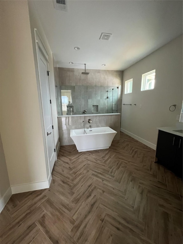 bathroom with vanity, parquet floors, and independent shower and bath