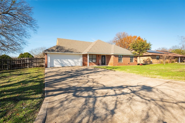 single story home featuring a front yard and a garage