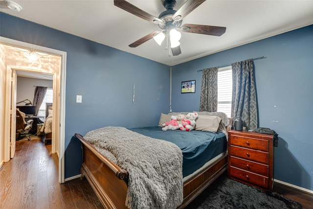 bedroom featuring ceiling fan and dark hardwood / wood-style flooring