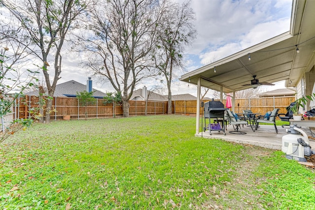 view of yard featuring a patio and ceiling fan