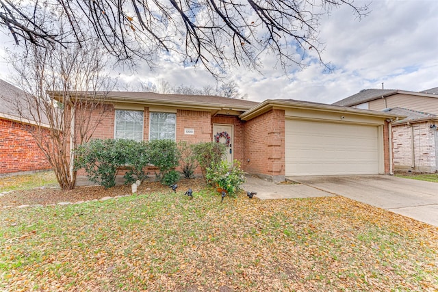 ranch-style home with a garage and a front yard