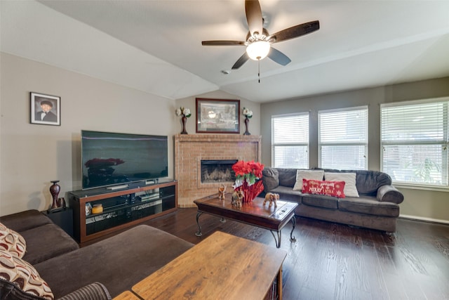 living room featuring lofted ceiling, dark hardwood / wood-style floors, and a wealth of natural light