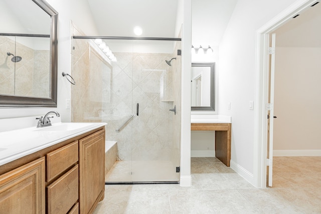 bathroom with tile patterned floors, vanity, and an enclosed shower