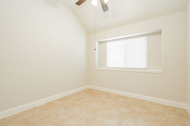 unfurnished room with ceiling fan, light tile patterned flooring, and vaulted ceiling