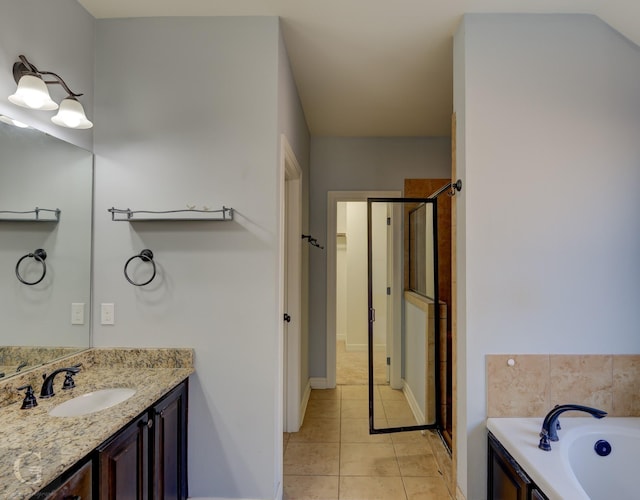 bathroom featuring tile patterned flooring, vanity, and plus walk in shower