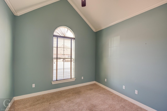 empty room featuring carpet, ceiling fan, crown molding, and vaulted ceiling