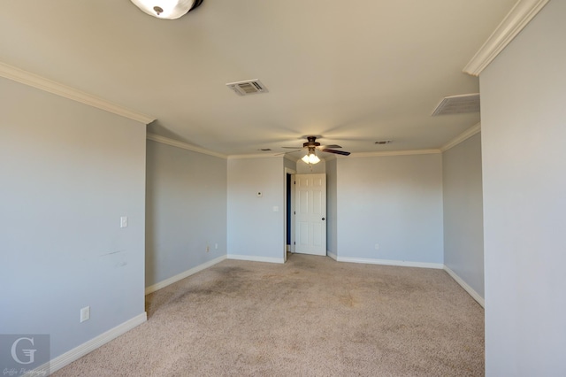 carpeted empty room featuring ornamental molding and ceiling fan