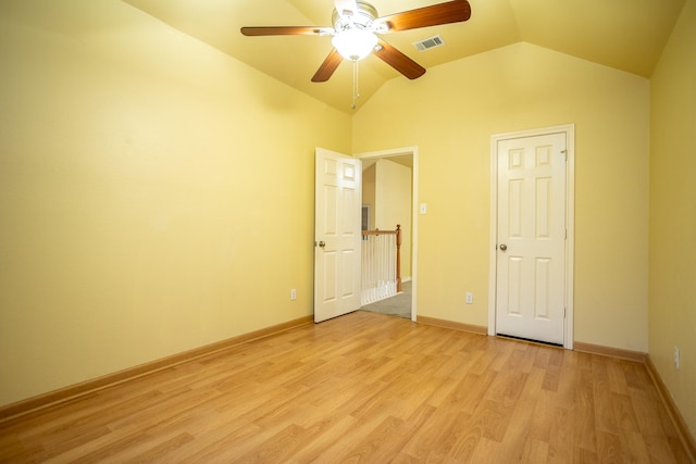 unfurnished bedroom with lofted ceiling, light hardwood / wood-style flooring, and ceiling fan