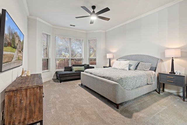 bedroom with crown molding, light colored carpet, and ceiling fan