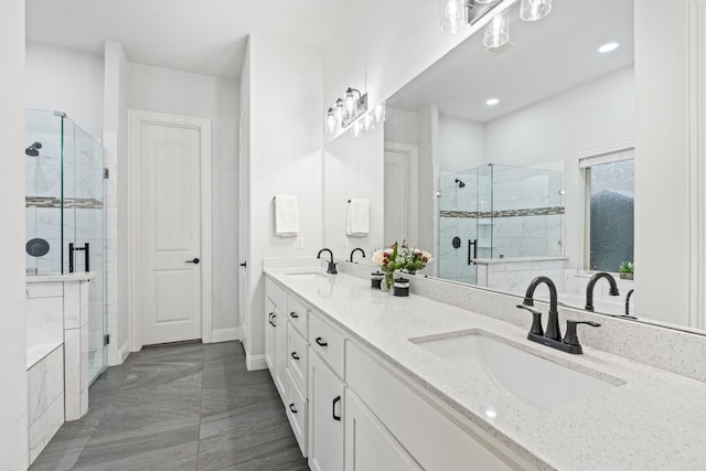 bathroom featuring walk in shower and vanity