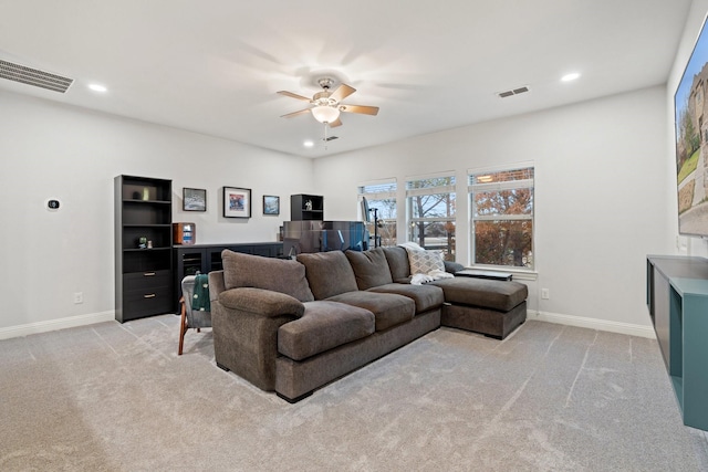 living room featuring light carpet and ceiling fan