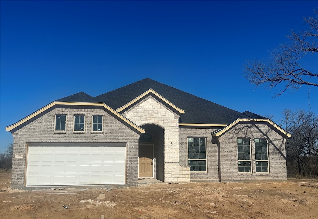 view of front of property featuring a garage