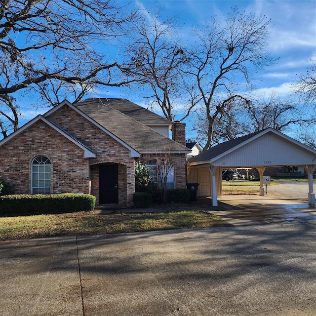 view of front of home with a carport