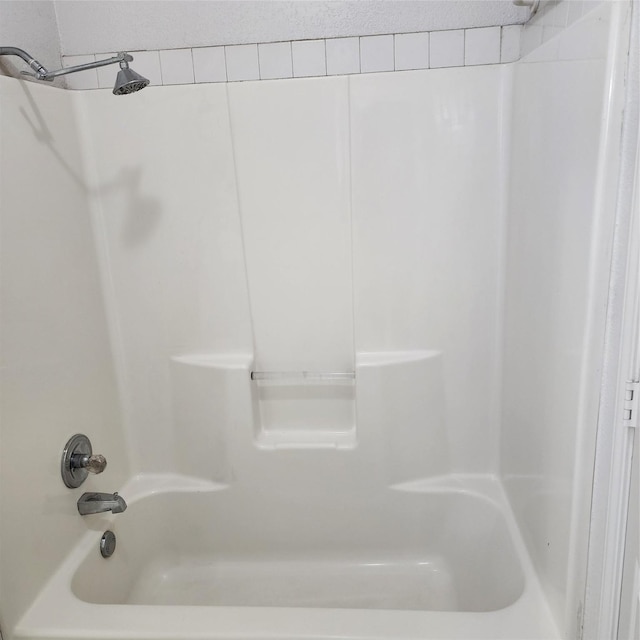 bathroom featuring  shower combination