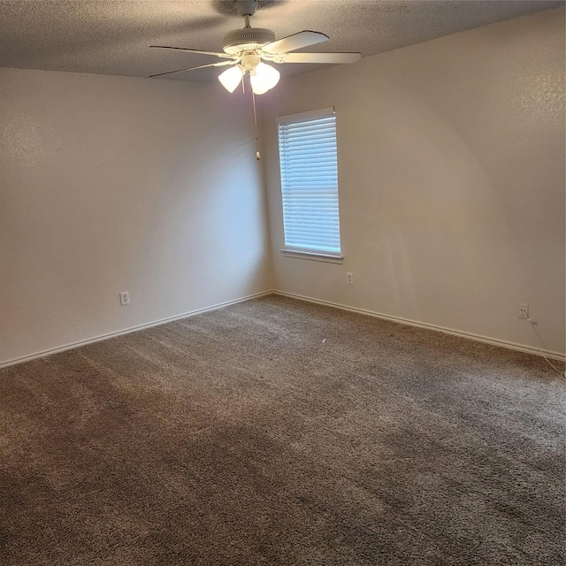 unfurnished room with ceiling fan, carpet flooring, and a textured ceiling