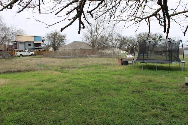 view of yard with a trampoline