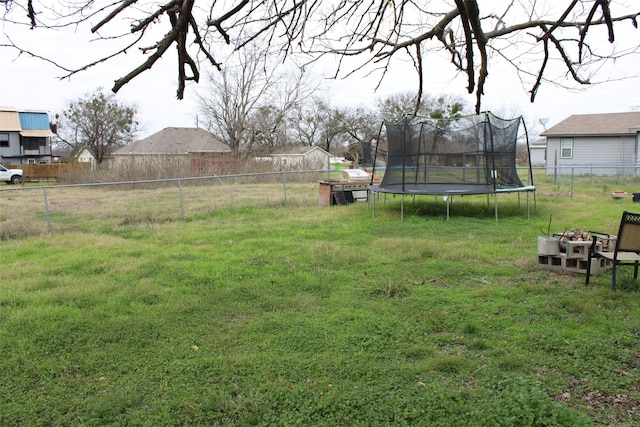 view of yard with a trampoline