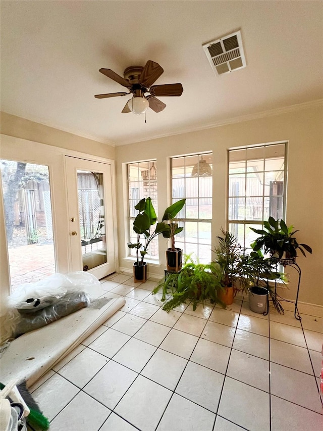 sunroom / solarium with ceiling fan