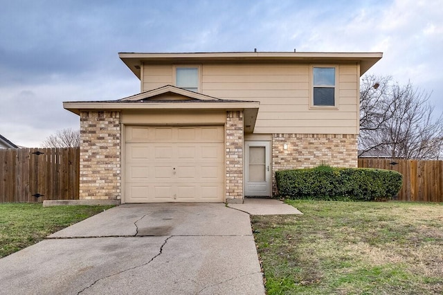 view of front of home featuring a garage and a front yard