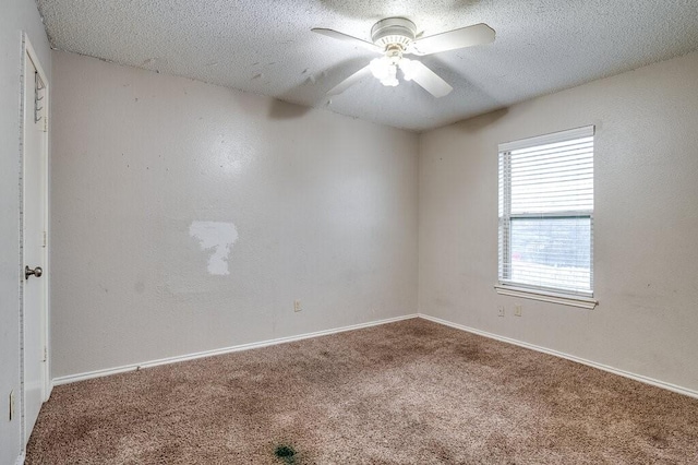 unfurnished room with carpet flooring, a textured ceiling, and ceiling fan